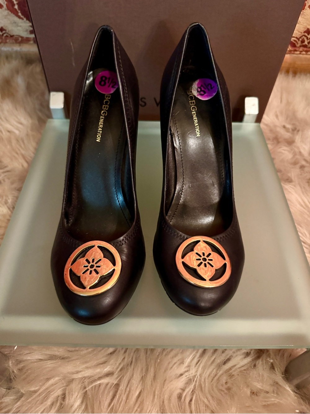 BCBGeneration Black Leather Pumps with Gold-Tone Medallion Accent